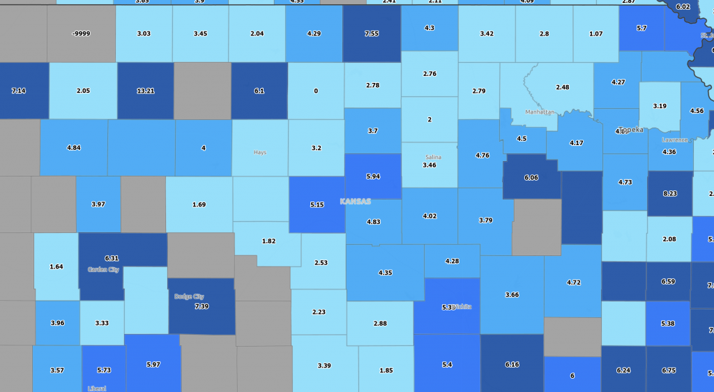 A bright blue map of Kansas showing rates of debt and delinquency by county.